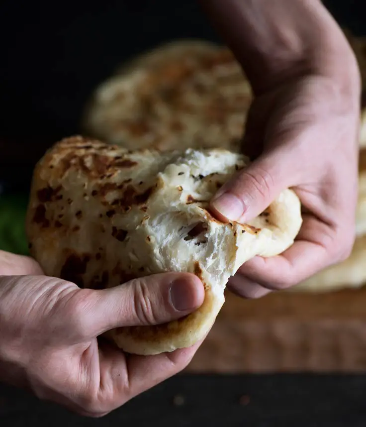 Cheese Stuffed Naan Topped With Garlic and Butter
