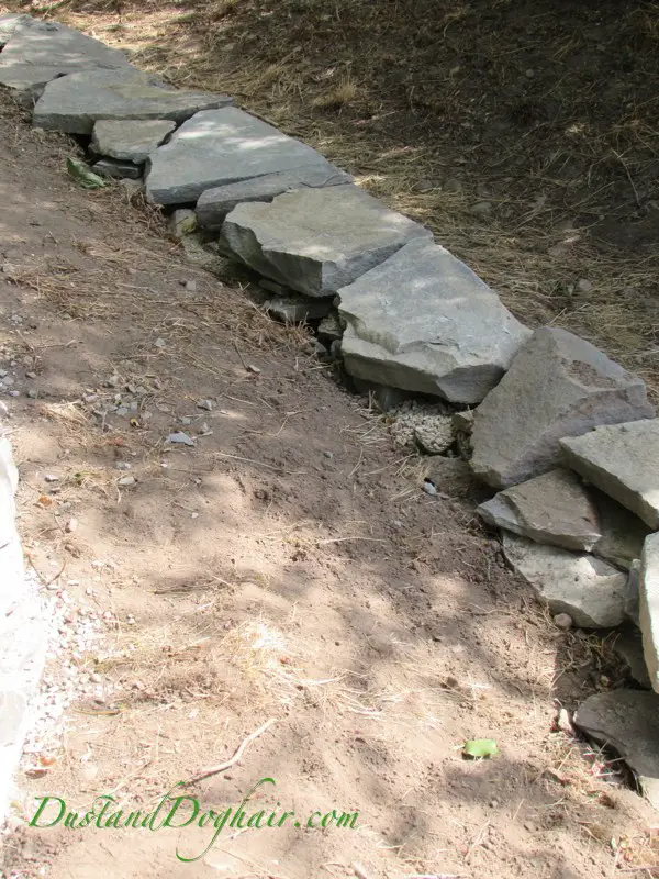 Stacked Retaining Rock Wall Homesteading DIY Project - The Homesteading Survival
